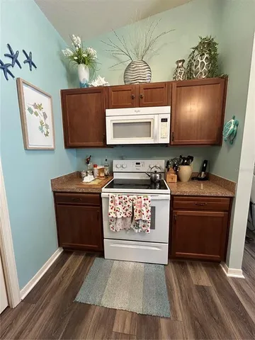 a room with wooden floor and cabinet