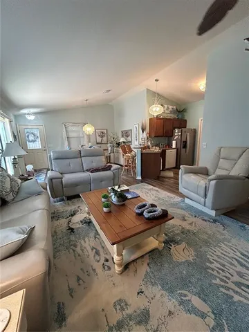a living room with furniture and a table