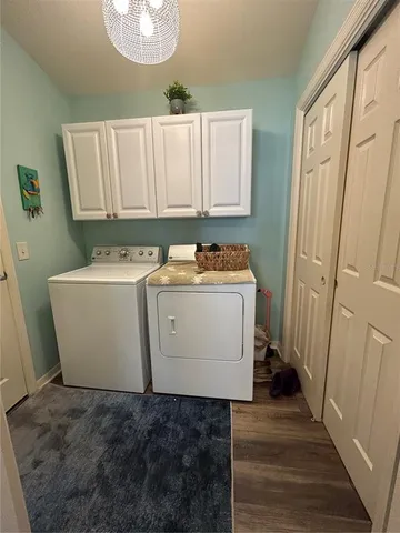 a utility room with a sink a washer and dryer