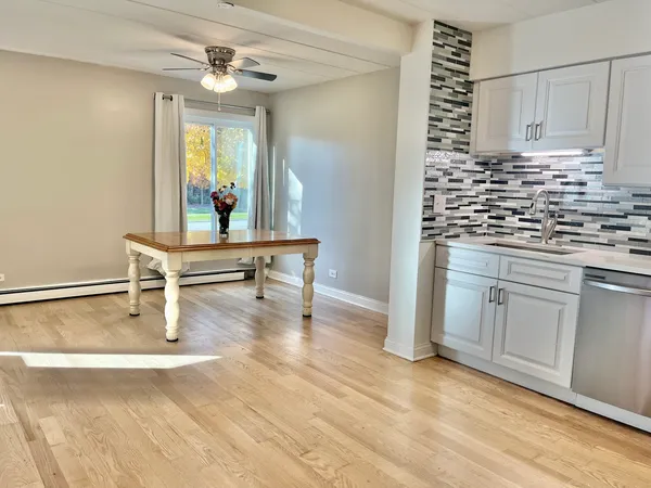 a kitchen with sink cabinets and window