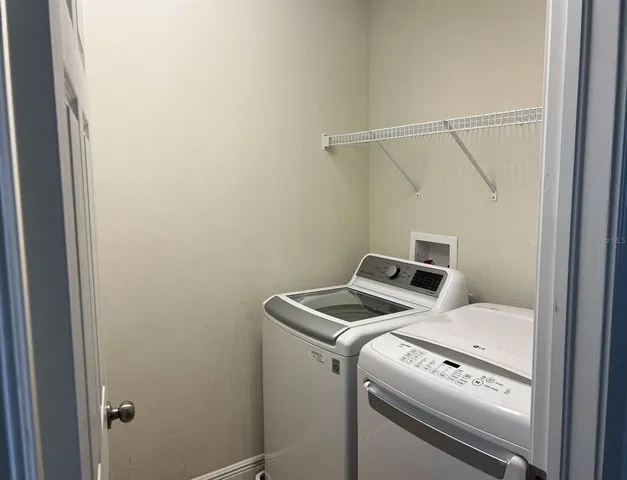 a utility room with dryer and washer