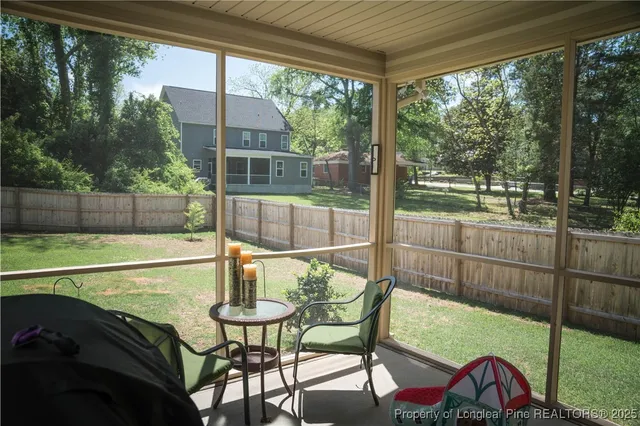 a view of a chair and table in the patio