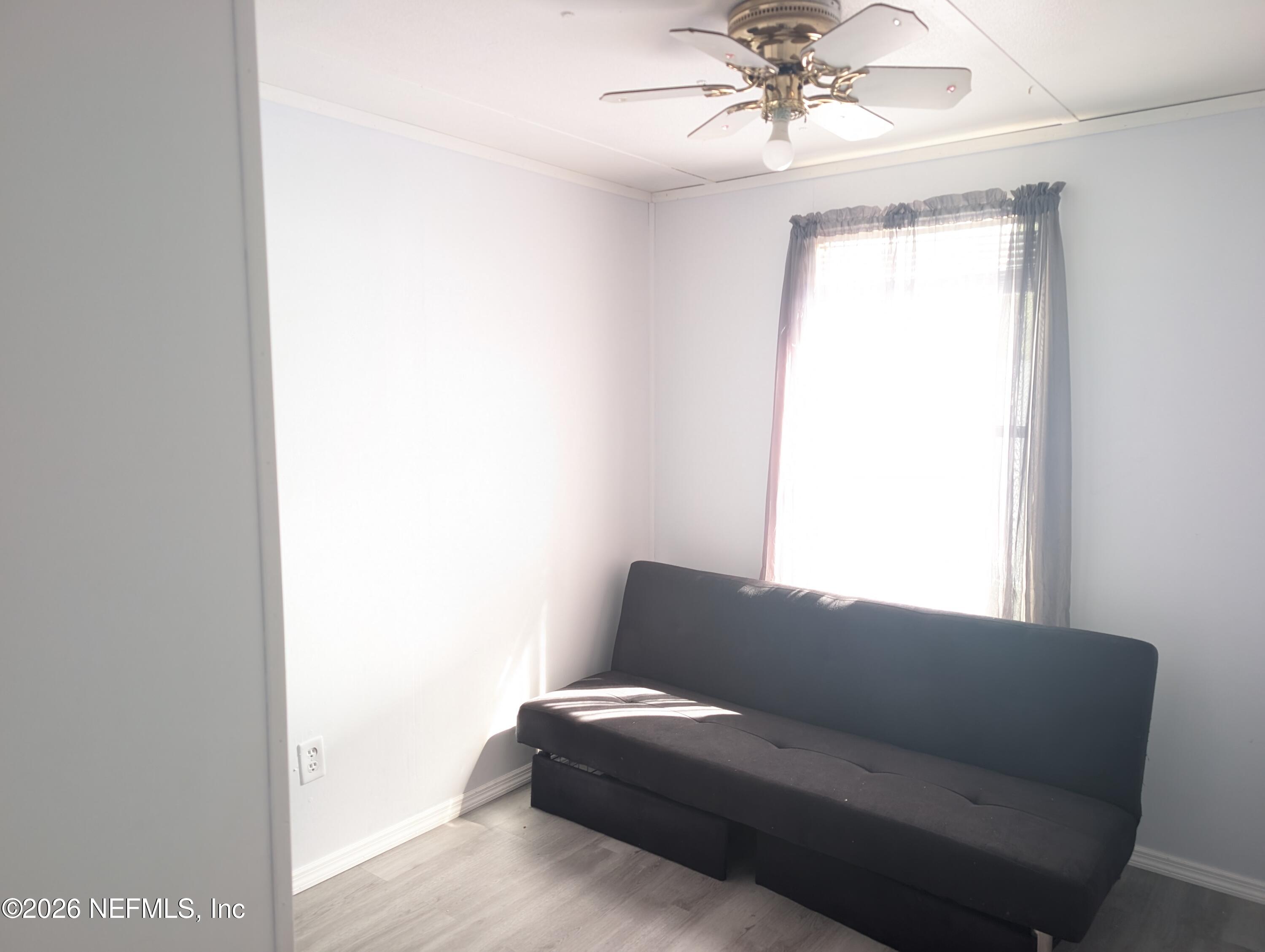 114 Durden Road Interlachen, FL 32148 - Photo 12 of 30 a living room with furniture and a window