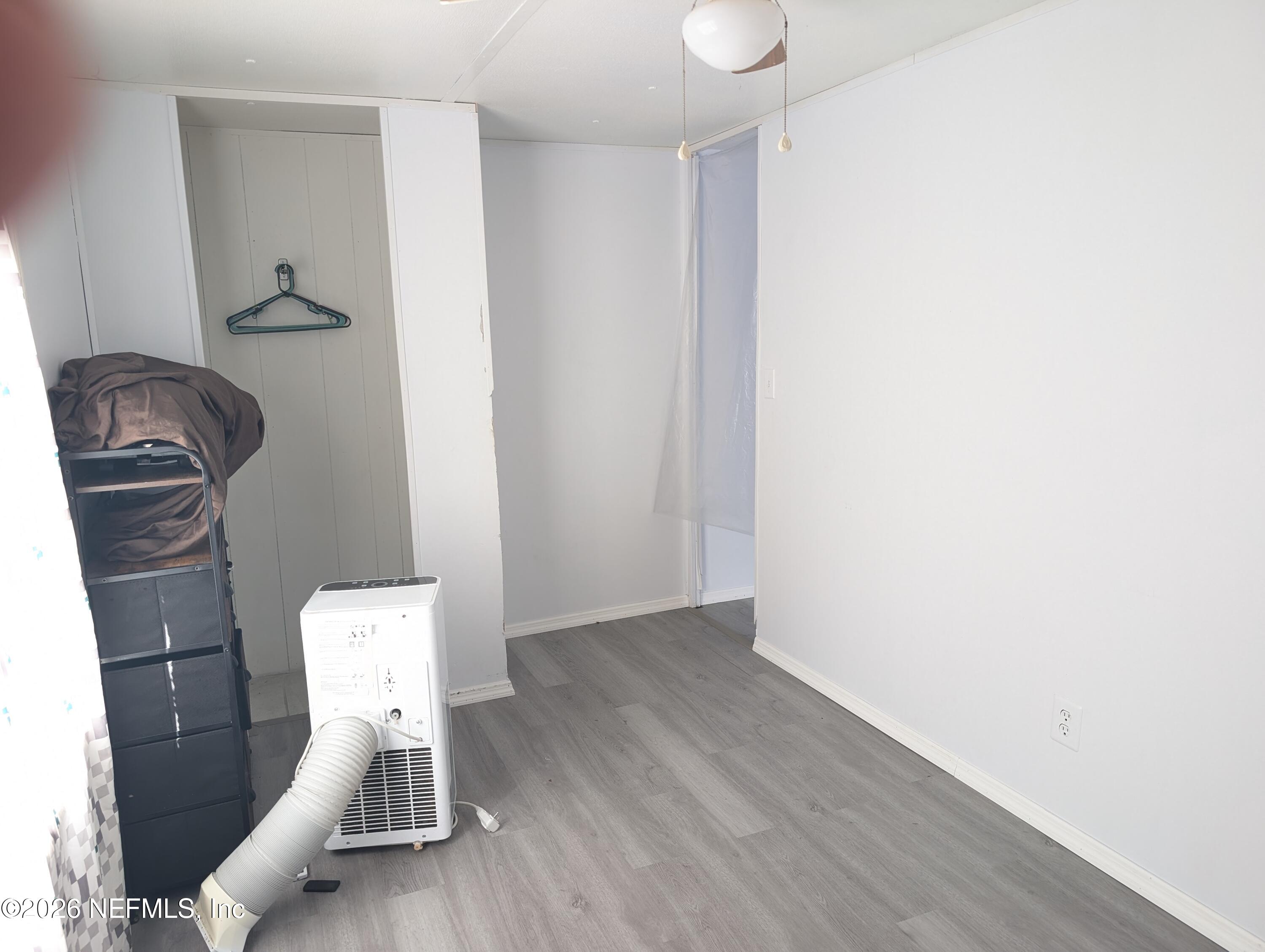 114 Durden Road Interlachen, FL 32148 - Photo 13 of 30 a chair and a table in a room