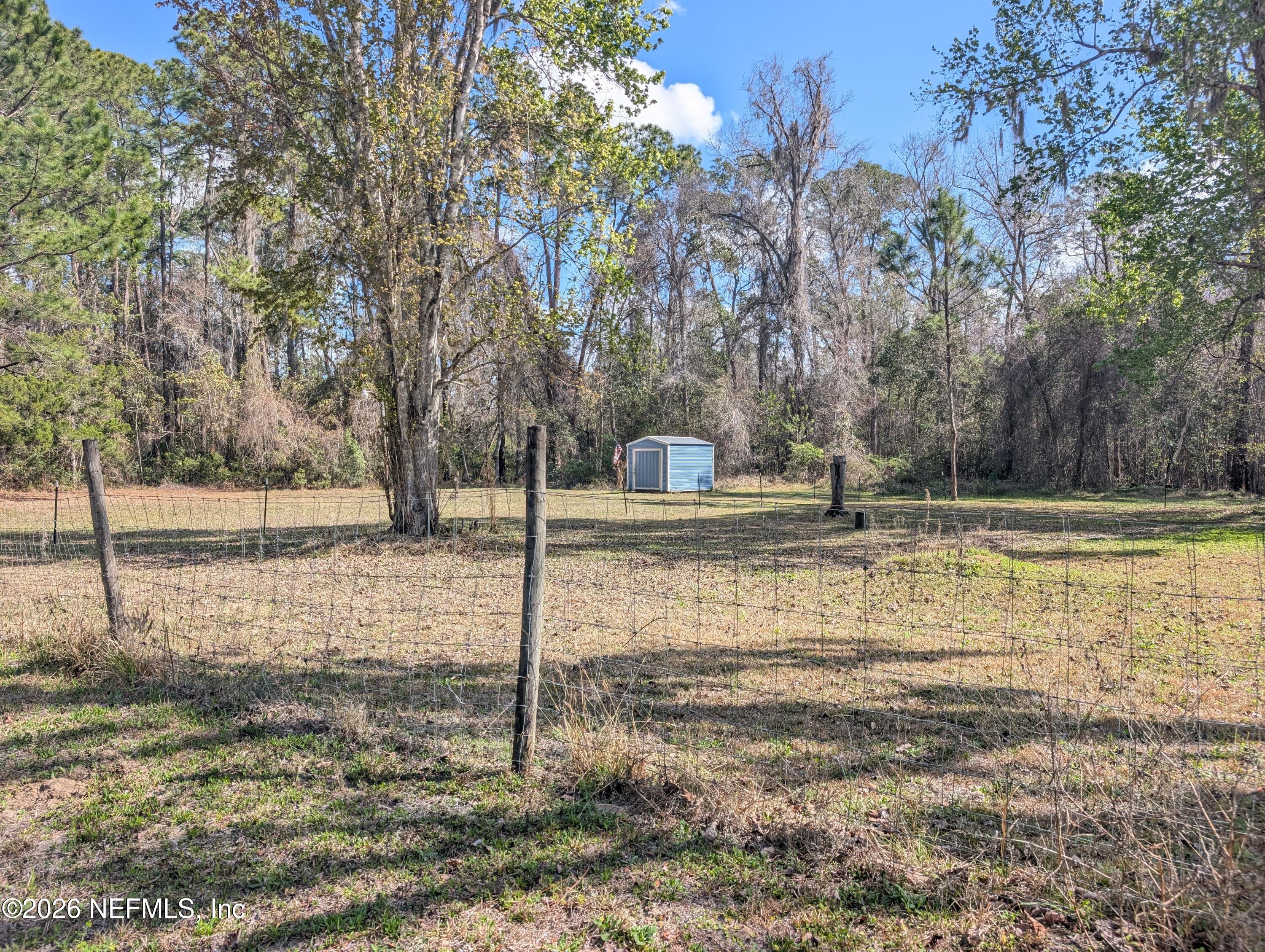 114 Durden Road Interlachen, FL 32148 - Photo 17 of 30 a backyard of a house with lots of green space