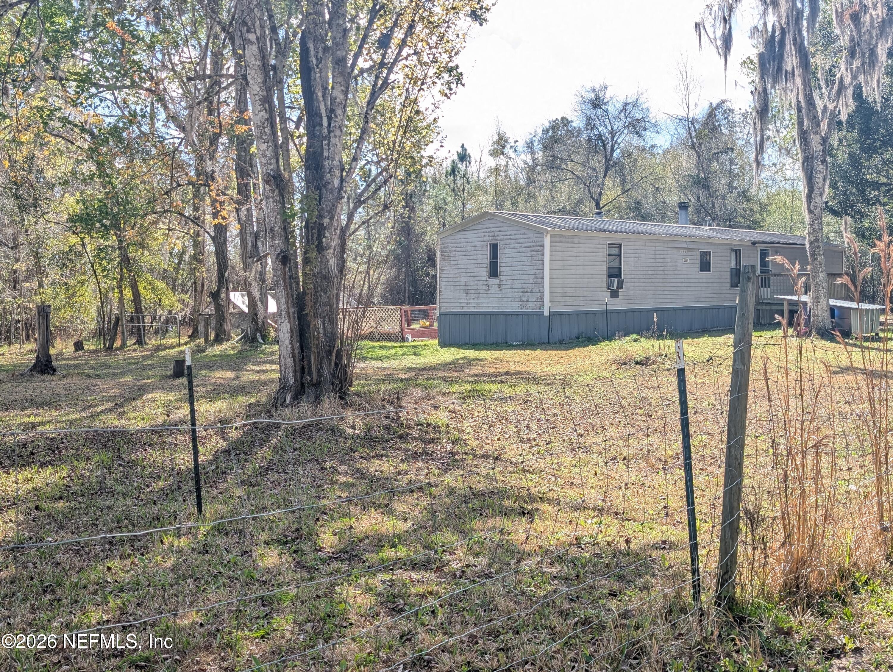 114 Durden Road Interlachen, FL 32148 - Photo 26 of 30 a view of a back yard of the house