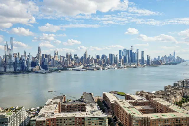 a view of a lake and tall building