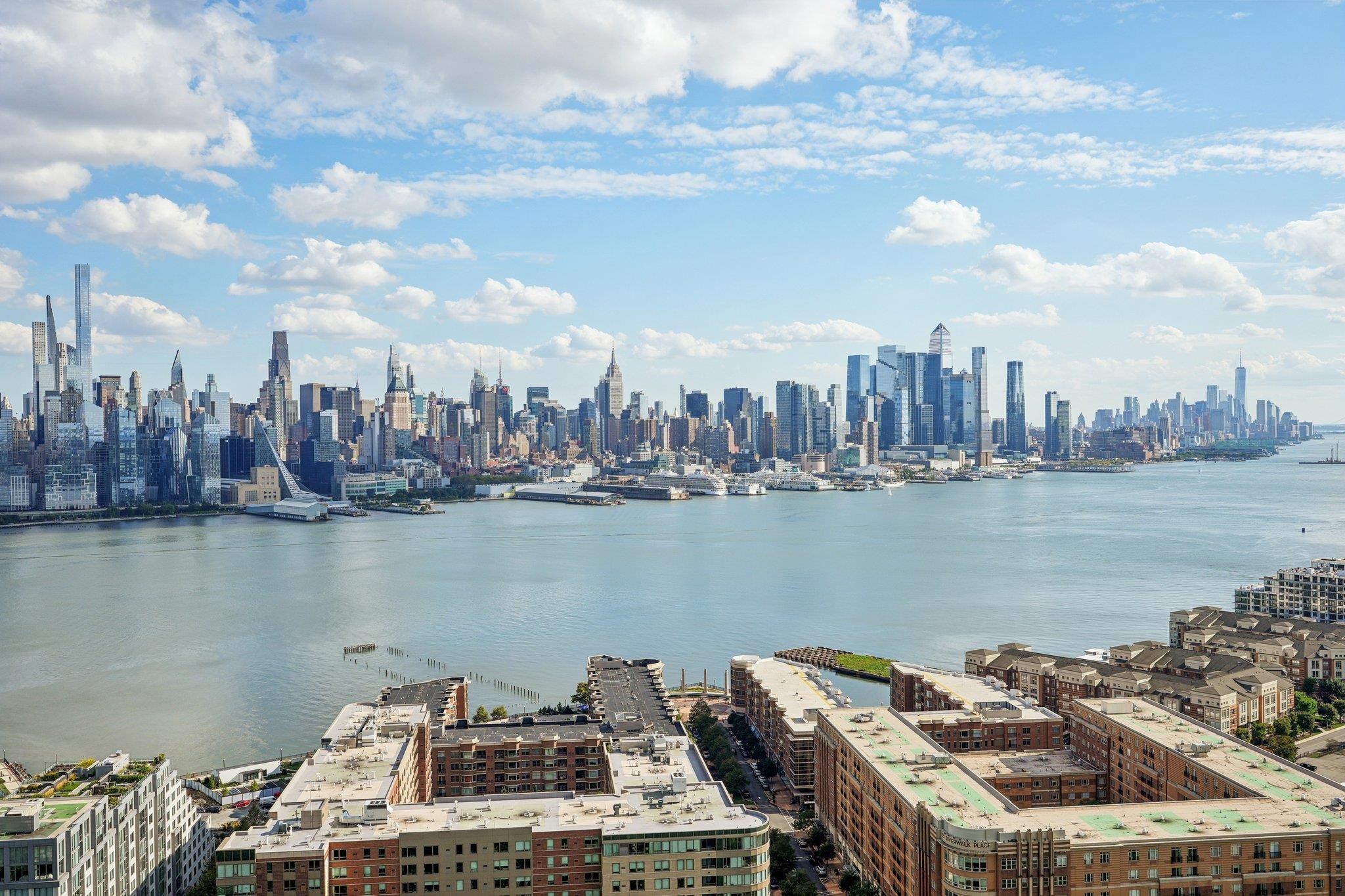 6040 Boulevard East, Unit 23G West New York, NJ 07093 - Photo 1 of 32 a view of a lake and tall building