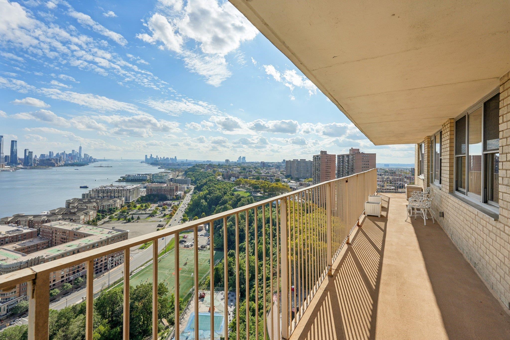6040 Boulevard East, Unit 23G West New York, NJ 07093 - Photo 15 of 32 a view of a balcony with city view
