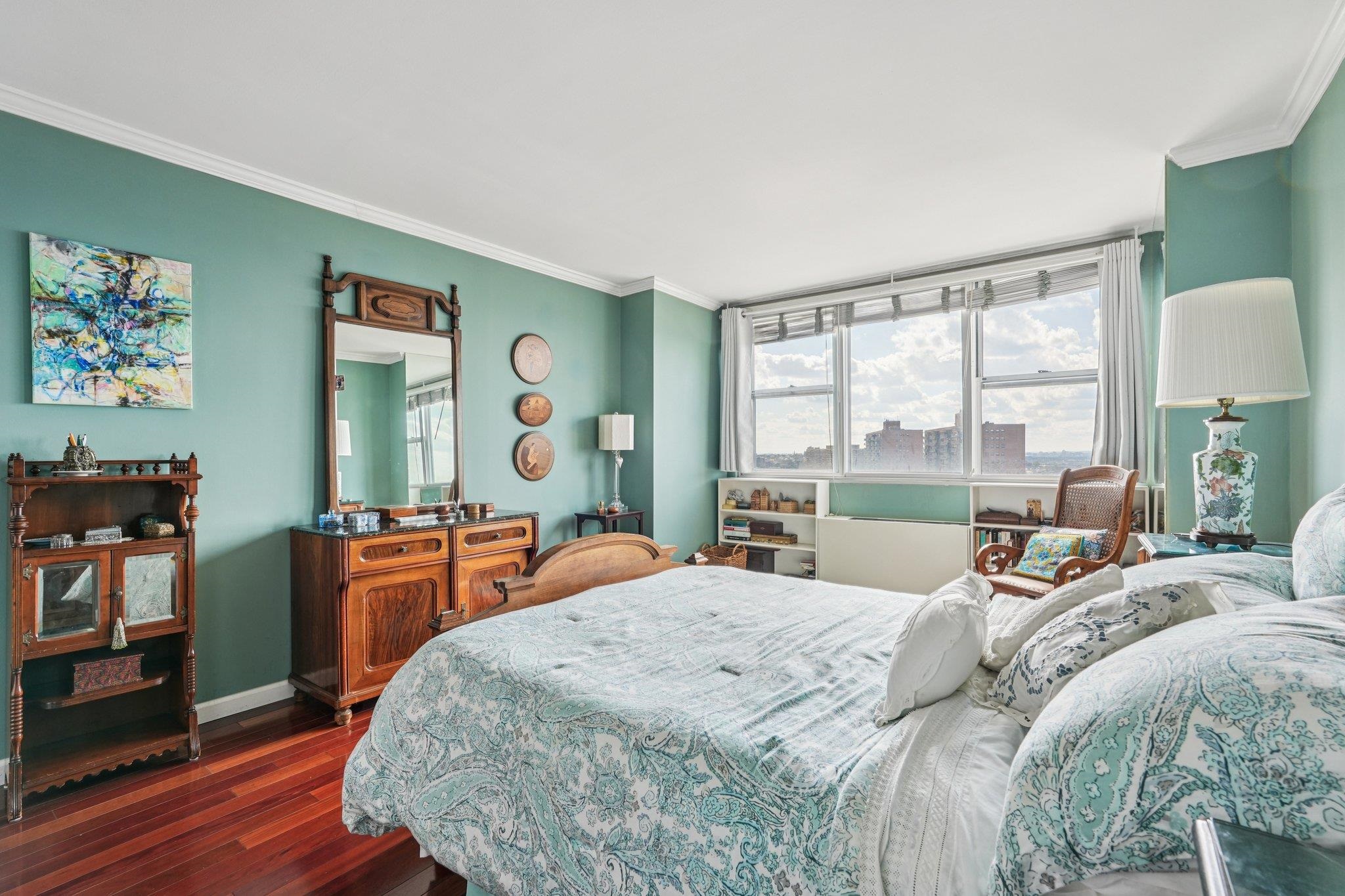 6040 Boulevard East, Unit 23G West New York, NJ 07093 - Photo 19 of 32 a bedroom with a large bed and a dresser