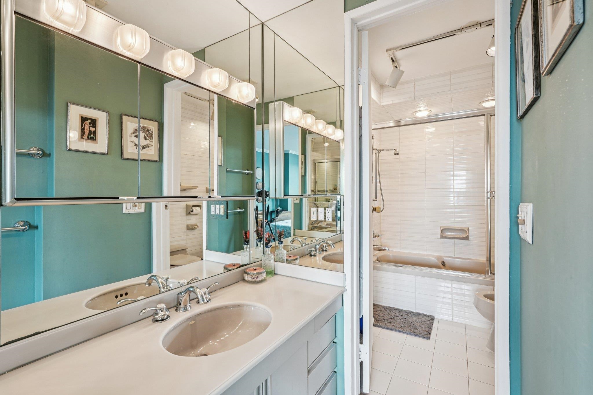 6040 Boulevard East, Unit 23G West New York, NJ 07093 - Photo 20 of 32 a bathroom with a sink and a mirror