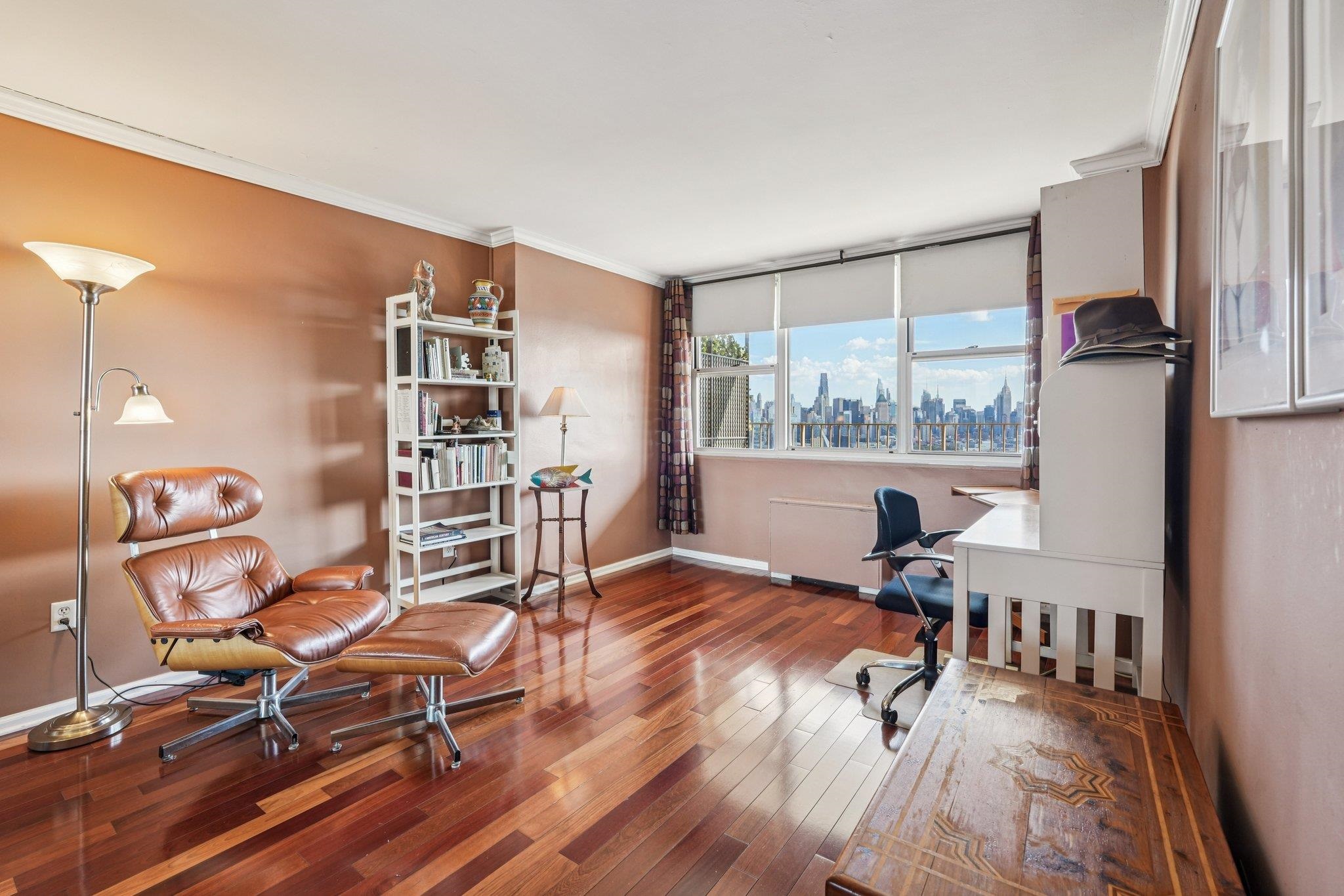6040 Boulevard East, Unit 23G West New York, NJ 07093 - Photo 21 of 32 a view of a workspace with furniture and a window