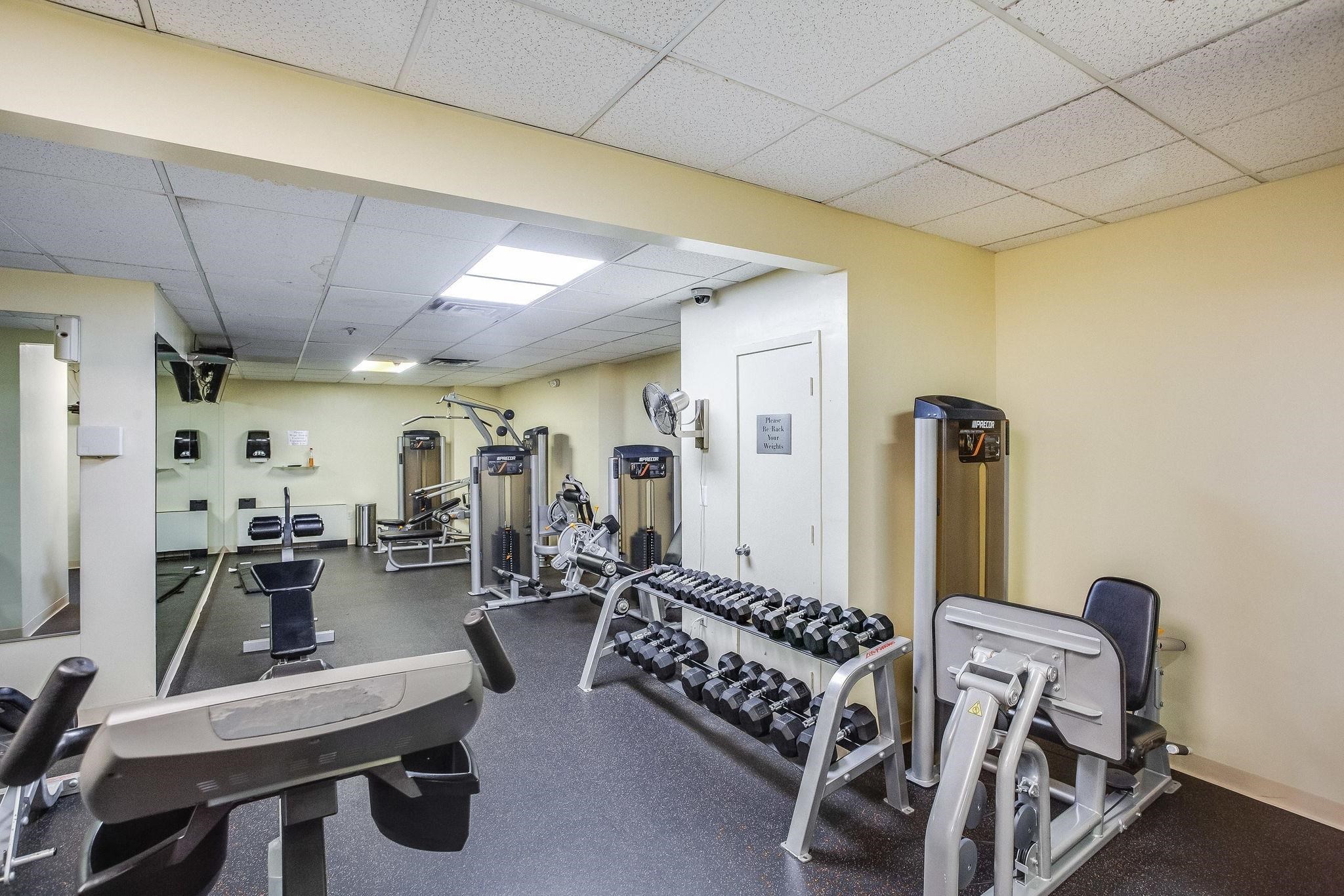 6040 Boulevard East, Unit 23G West New York, NJ 07093 - Photo 26 of 32 a view of a room with gym equipment