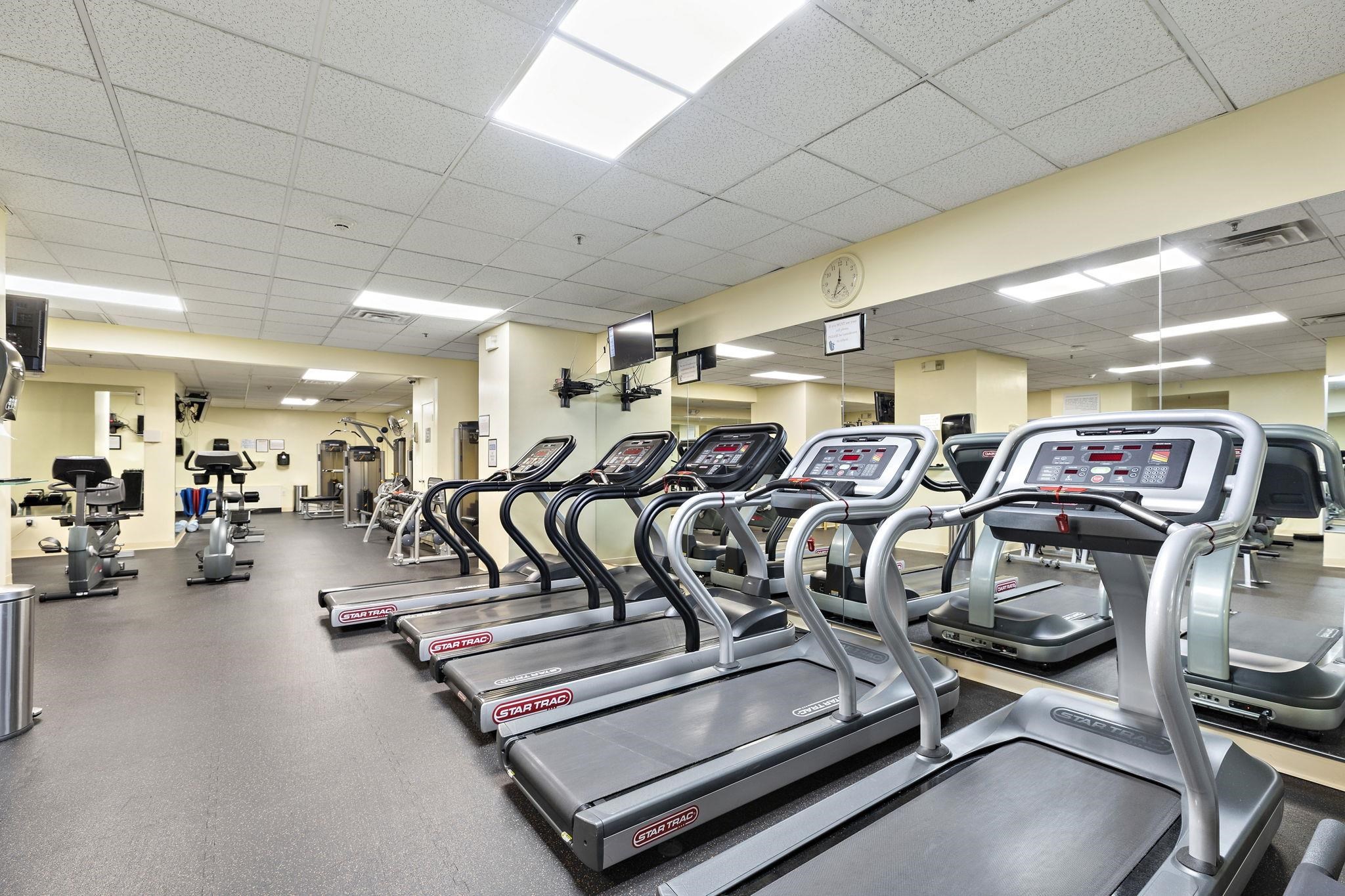 6040 Boulevard East, Unit 23G West New York, NJ 07093 - Photo 27 of 32 a view of a room with gym equipment