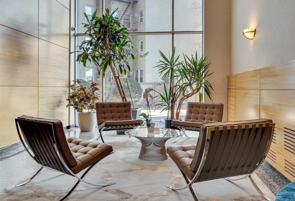 6040 Boulevard East, Unit 23G West New York, NJ 07093 - Photo 31 of 32 a living room with furniture and a potted plant