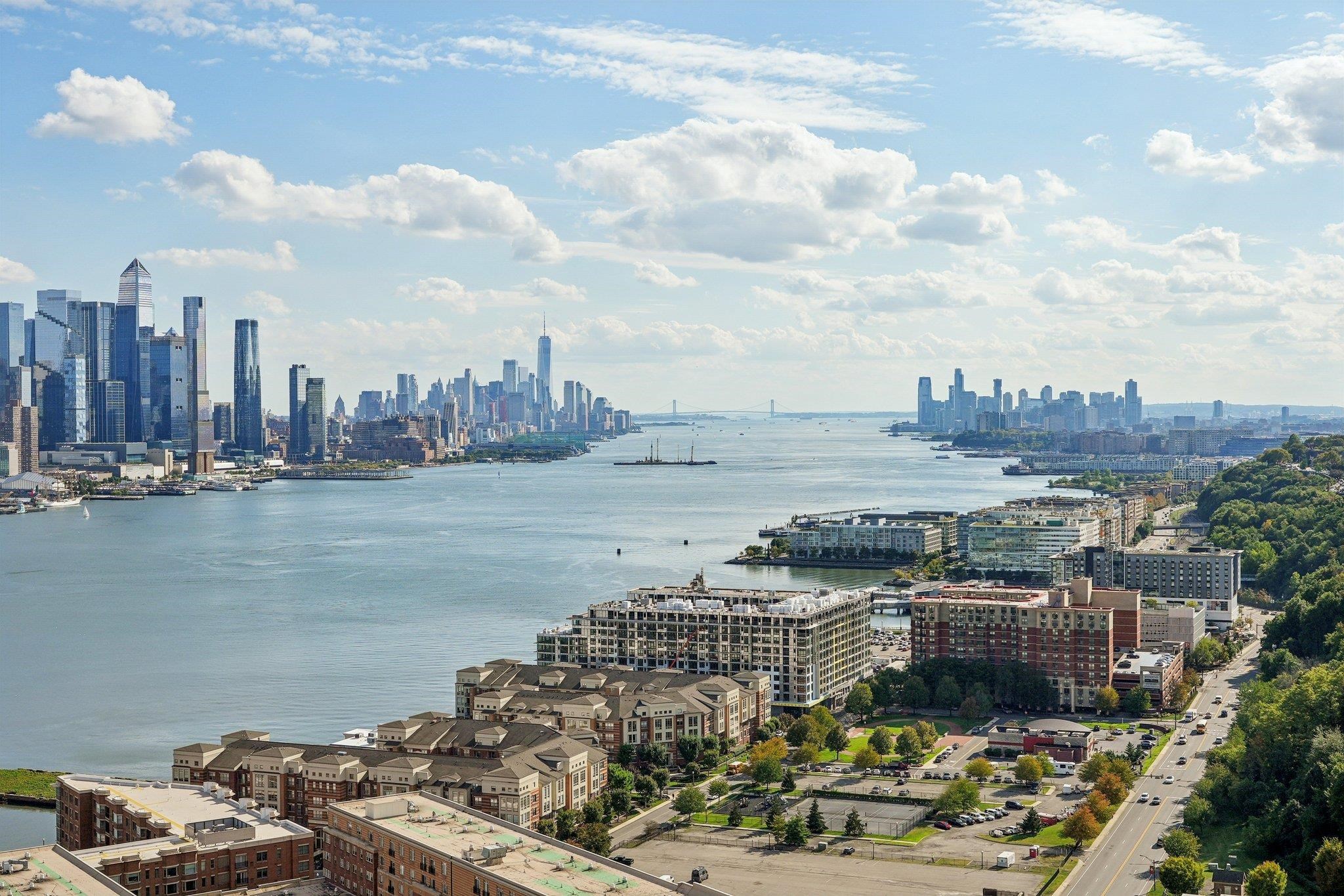6040 Boulevard East, Unit 23G West New York, NJ 07093 - Photo 8 of 32 a view of a lake and tall building