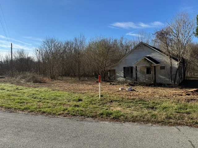 a backyard of a house with lots of green space