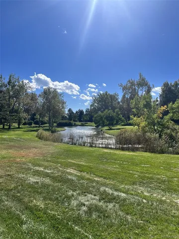 a view of a golf course with a lake