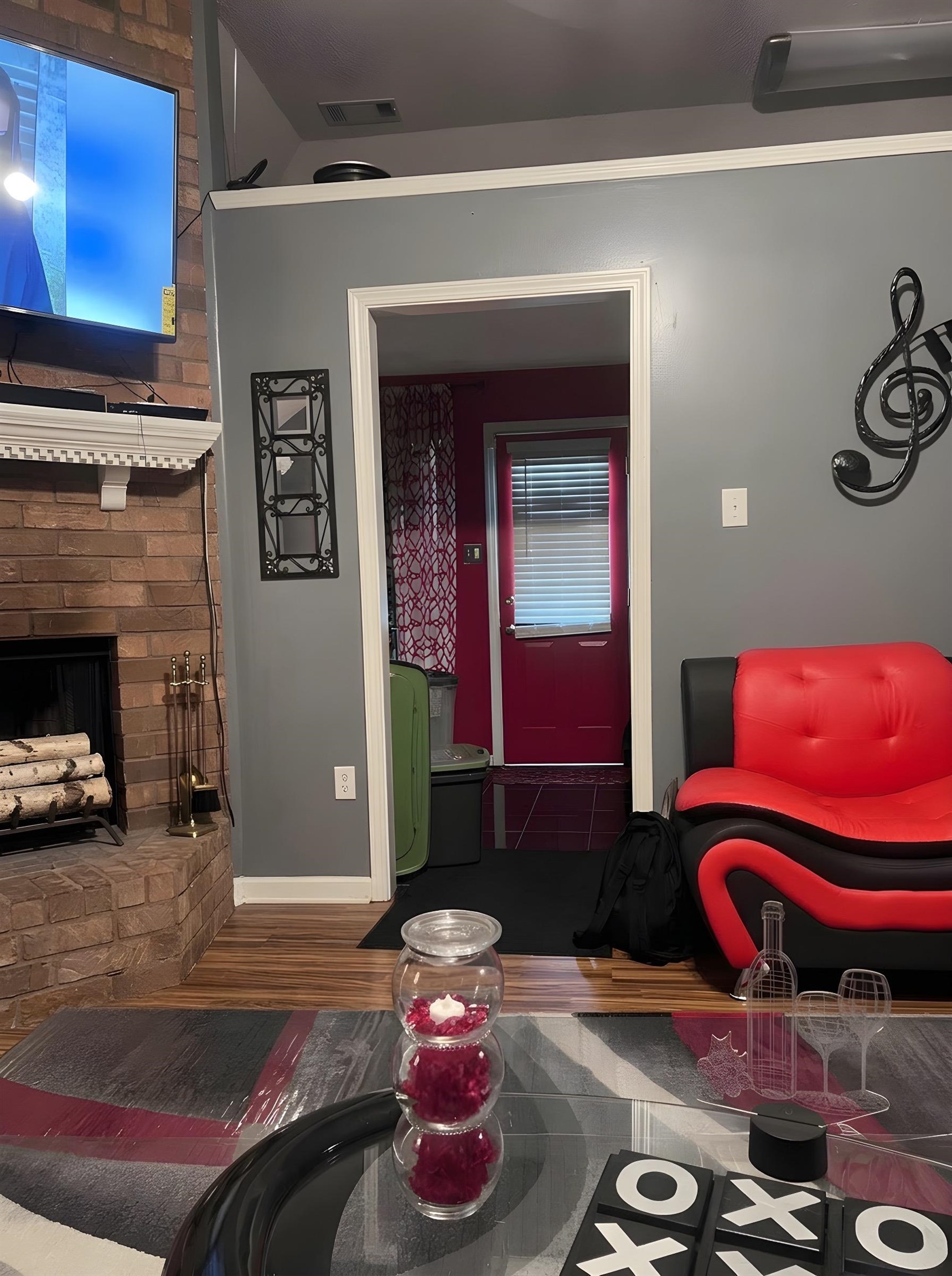 4005 Long Creek Road Memphis, TN 38125 - Photo 13 of 37 Living room with a fireplace and wood finished floors