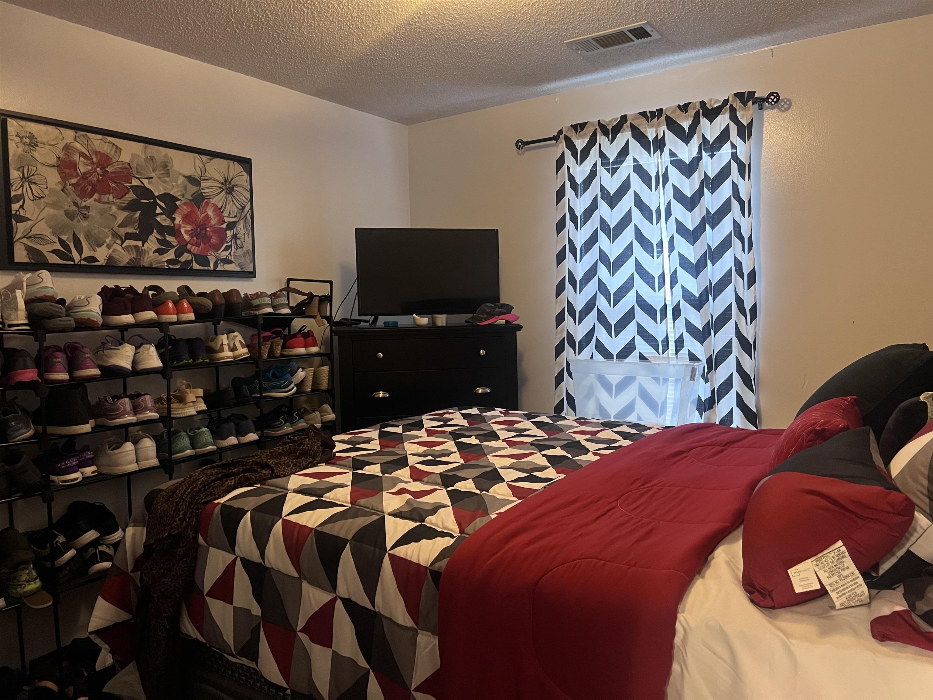 4005 Long Creek Road Memphis, TN 38125 - Photo 24 of 37 Bedroom with a textured ceiling