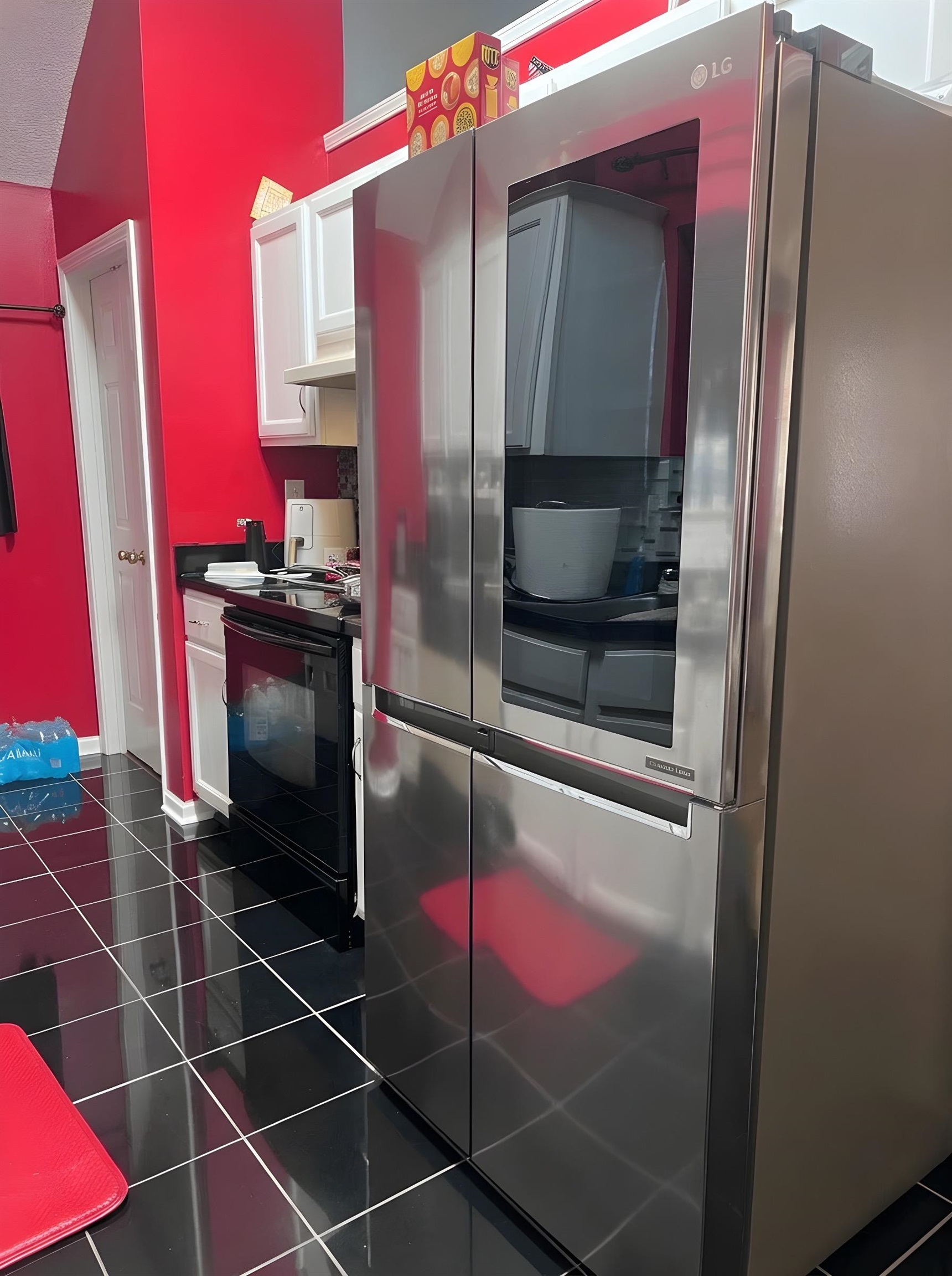 4005 Long Creek Road Memphis, TN 38125 - Photo 9 of 37 Kitchen featuring smart refrigerator, white cabinetry, black range with electric stovetop, dark countertops, and dark tile patterned flooring