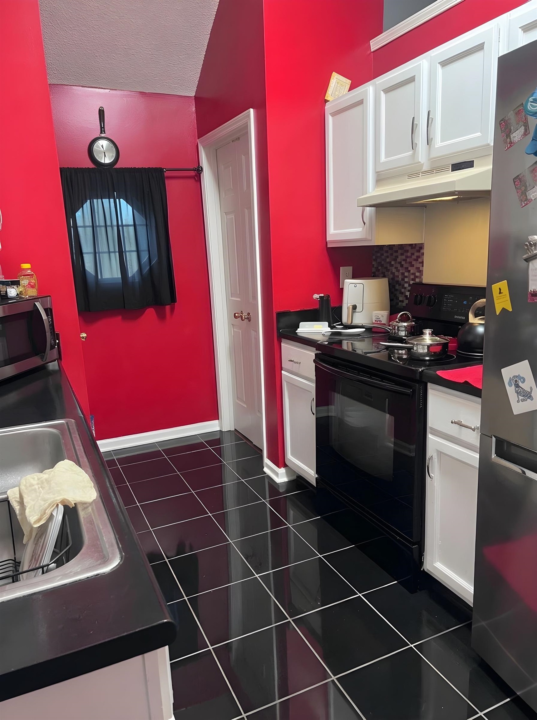 4005 Long Creek Road Memphis, TN 38125 - Photo 10 of 37 Kitchen featuring stainless steel appliances, white cabinets, and dark countertops