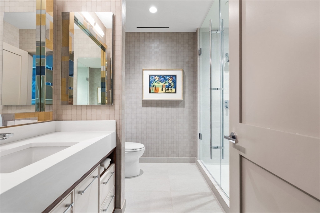 1 Dalton Street, Unit 3003 Boston, MA 02115 - Photo 13 of 24 a bathroom with a sink and a mirror