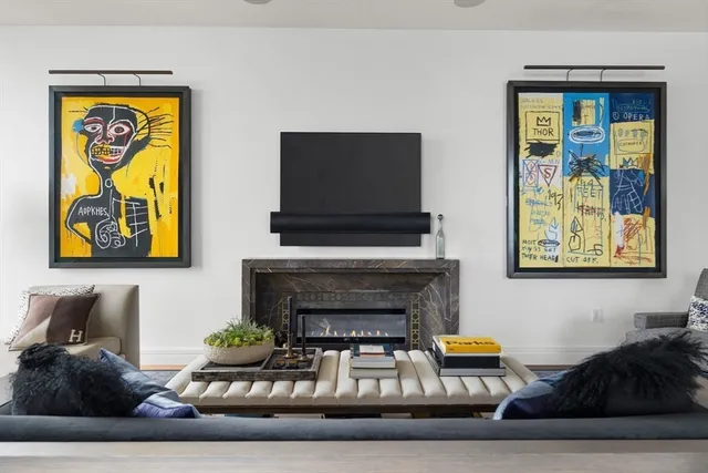 a living room with furniture and a fireplace