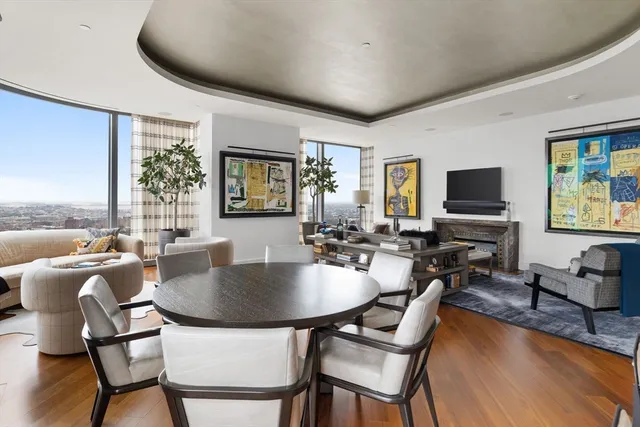 a living room with fireplace furniture and a flat screen tv