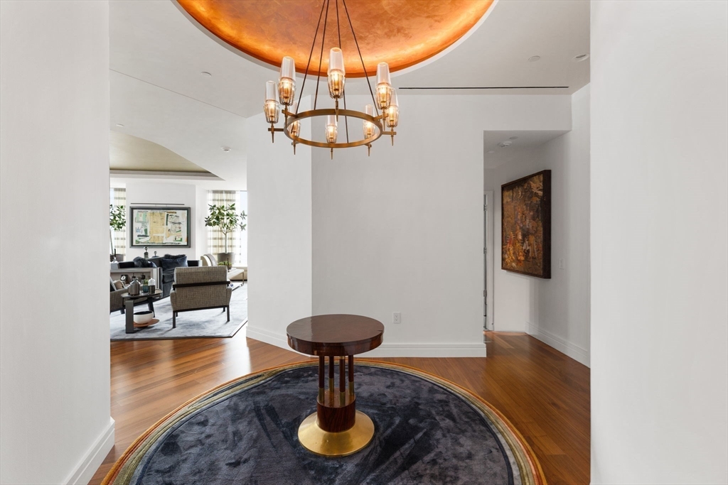 1 Dalton Street, Unit 3003 Boston, MA 02115 - Photo 9 of 24 a view of a livingroom with furniture and a chandelier