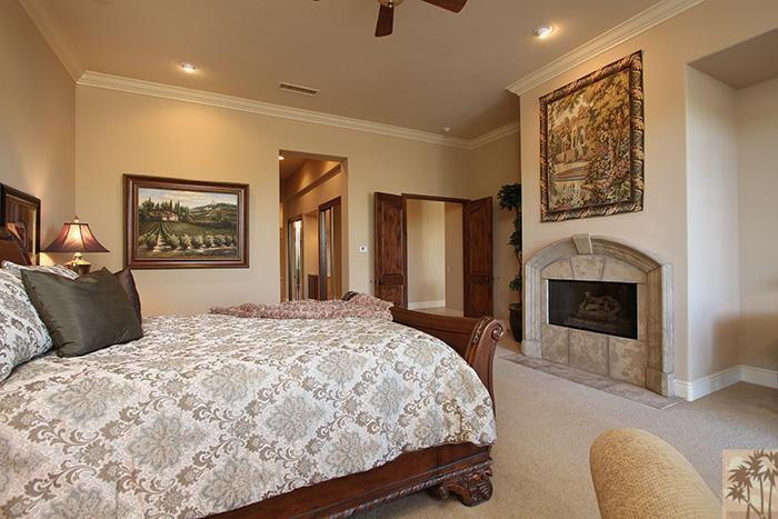57990 Troon La Quinta, CA 92253 - Photo 14 of 30 a bedroom with a large bed and a couch