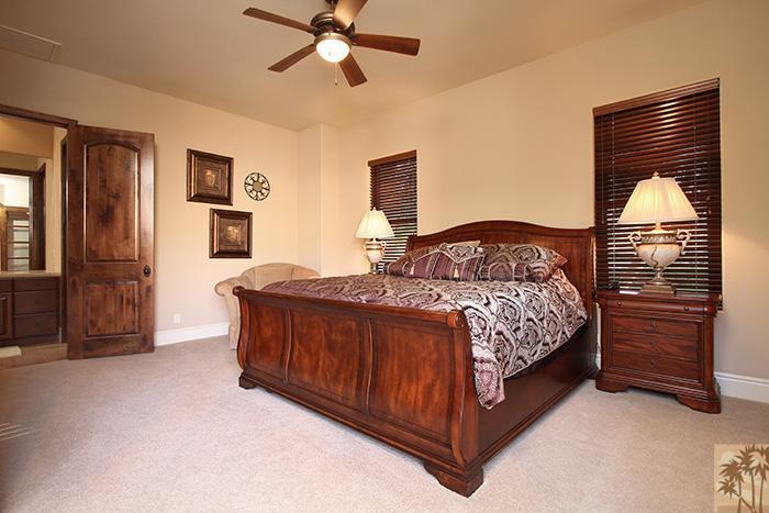 57990 Troon La Quinta, CA 92253 - Photo 17 of 30 a bedroom with a bed and cabinets