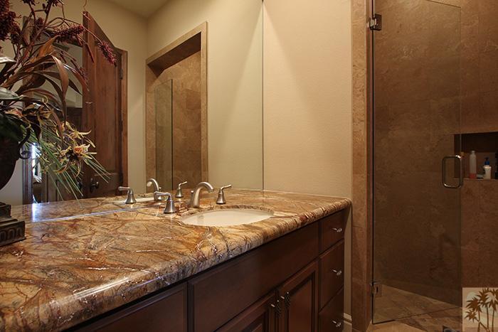 57990 Troon La Quinta, CA 92253 - Photo 22 of 30 a bathroom with a granite countertop sink and a mirror