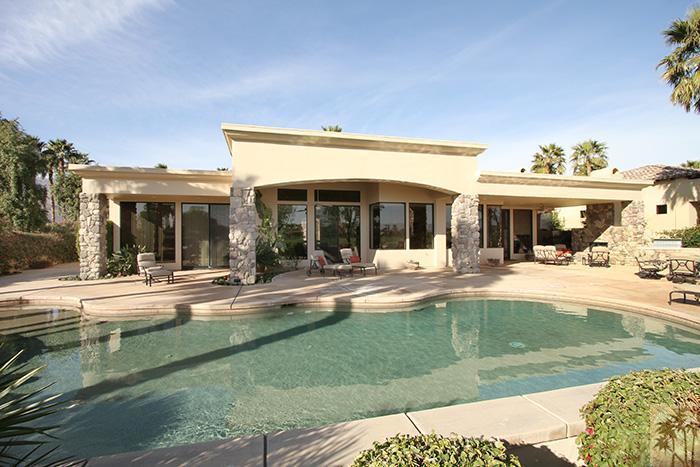 57990 Troon La Quinta, CA 92253 - Photo 28 of 30 a view of a house with swimming pool and a porch