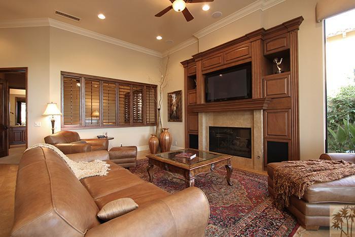 57990 Troon La Quinta, CA 92253 - Photo 9 of 30 a living room with furniture fireplace and flat screen tv
