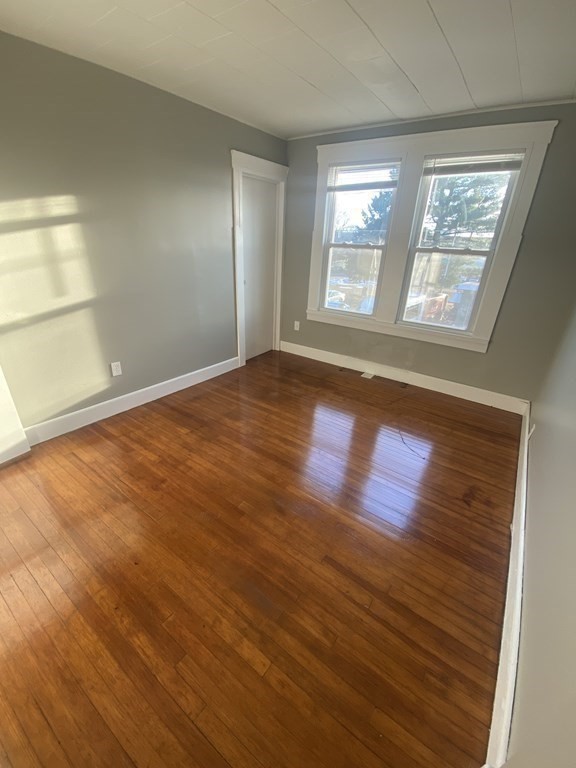 56 Exposition Terrace West Springfield, MA 01089 - Photo 12 of 16 an empty room with wooden floor and windows