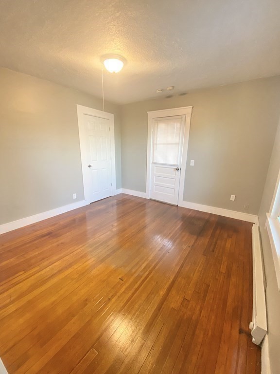 56 Exposition Terrace West Springfield, MA 01089 - Photo 13 of 16 a view of an empty room and wooden floor