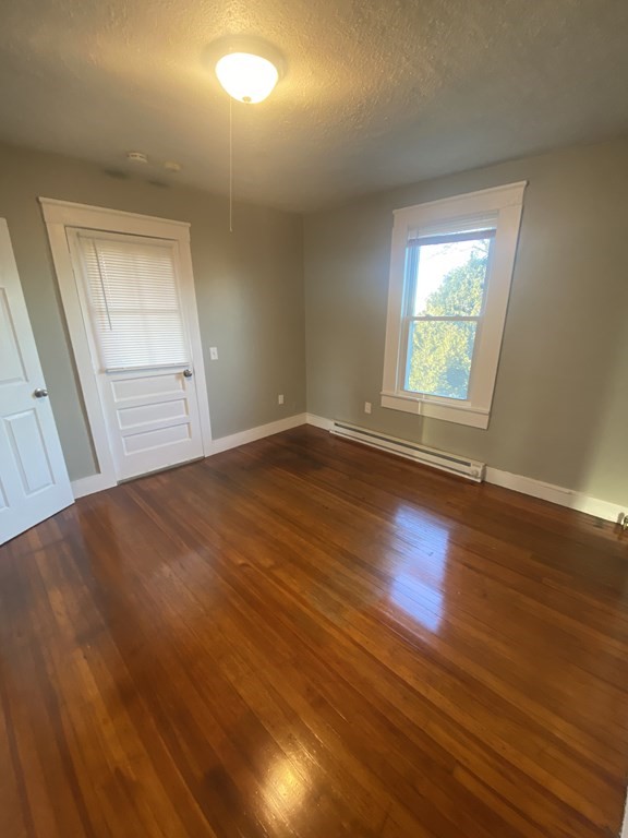 56 Exposition Terrace West Springfield, MA 01089 - Photo 15 of 16 an empty room with wooden floor and windows