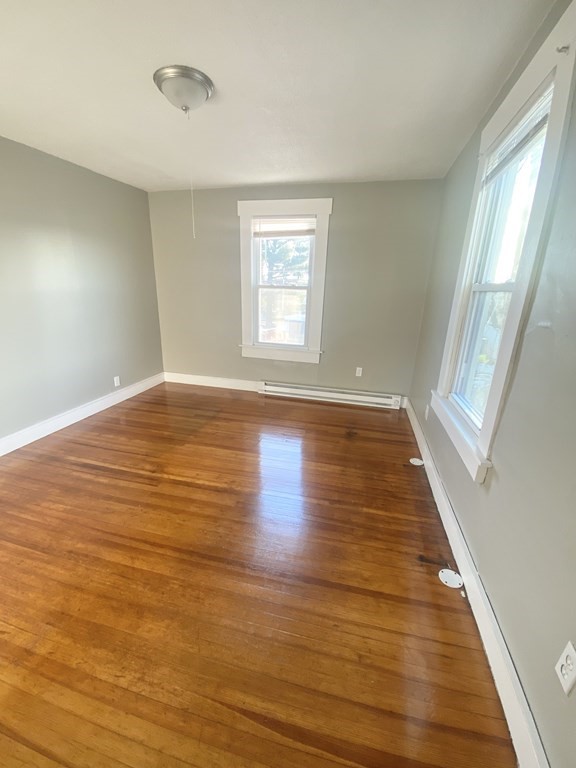 56 Exposition Terrace West Springfield, MA 01089 - Photo 16 of 16 a view of an empty room with wooden floor and a window