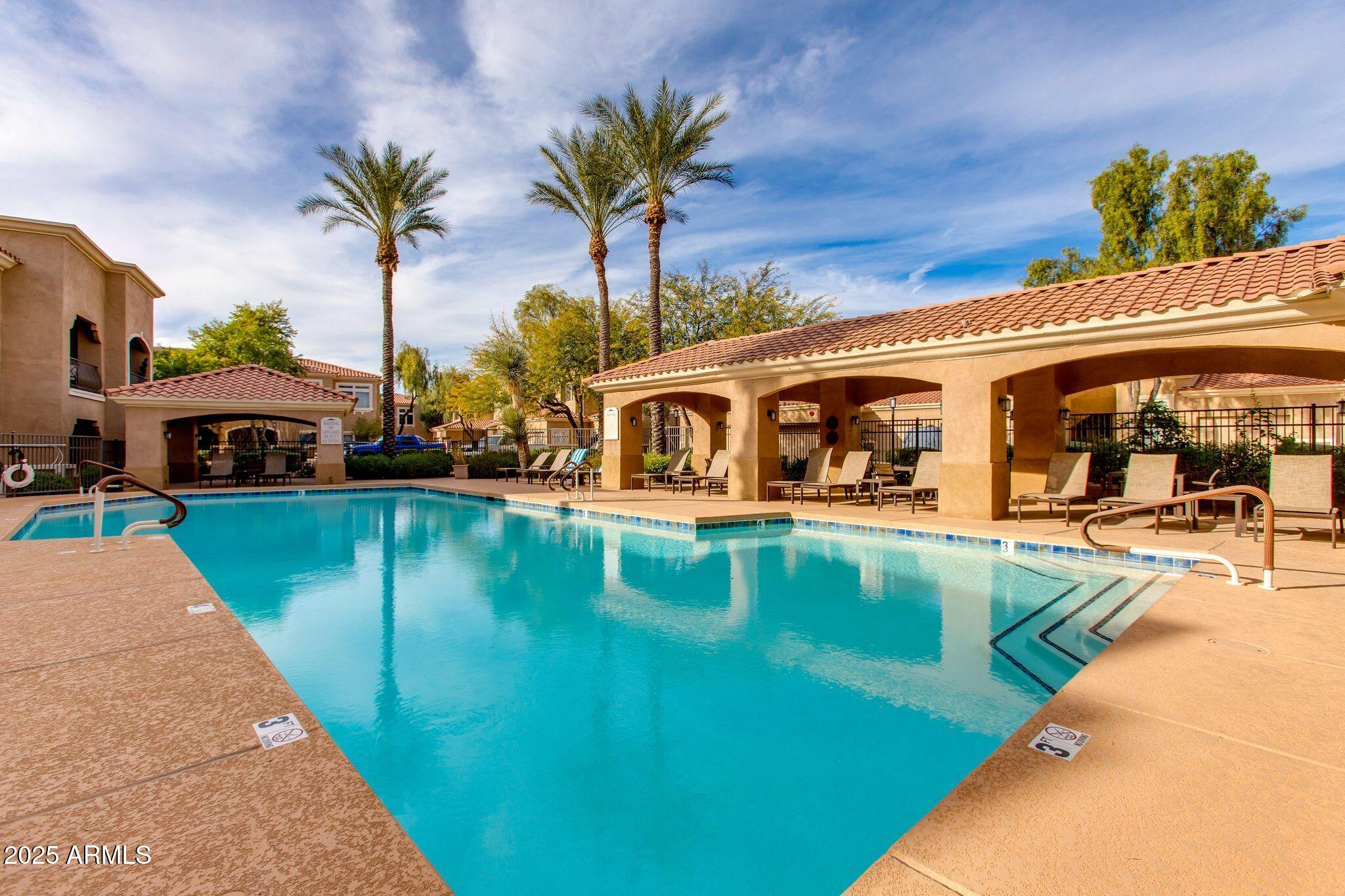 8245 East Bell Road, Unit 150 Scottsdale, AZ 85260 - Photo 11 of 12 a view of a house with pool