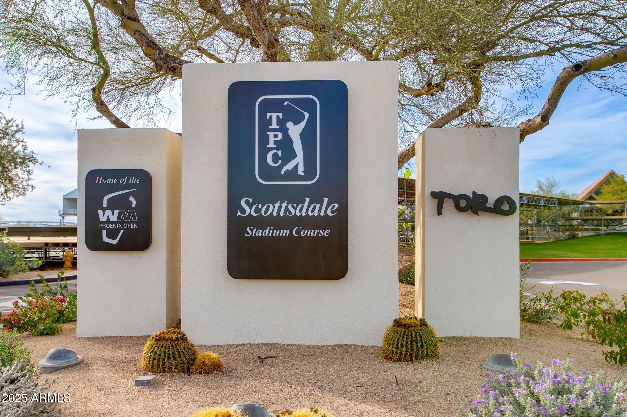 8245 East Bell Road, Unit 150 Scottsdale, AZ 85260 - Photo 12 of 12 a front view of a house with parking area