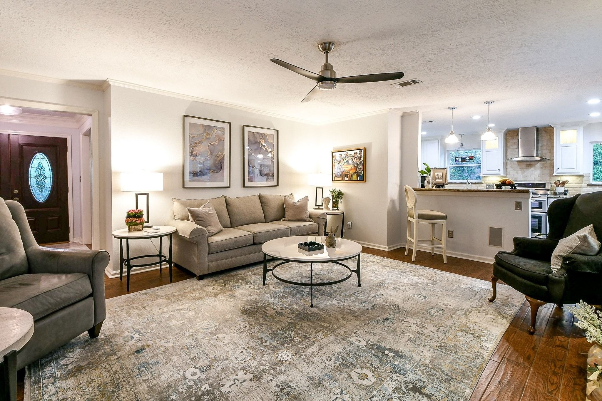 6607 Misty Springs Lane Spring, TX 77379 - Photo 11 of 31 Elegant entryway view with seamless access to the modern kitchen.