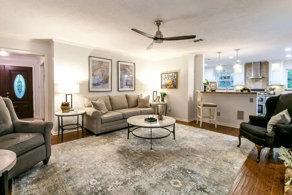 a living room with furniture and a large window