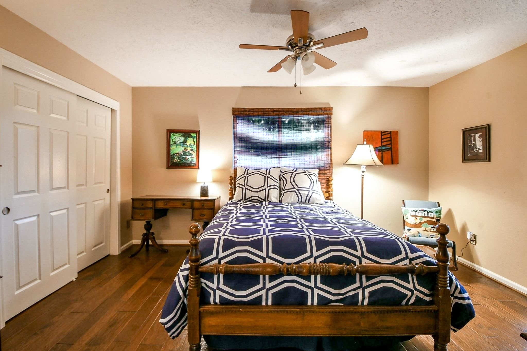 6607 Misty Springs Lane Spring, TX 77379 - Photo 18 of 31 Discover a spacious bedroom with an attached bath at the hallway's end.