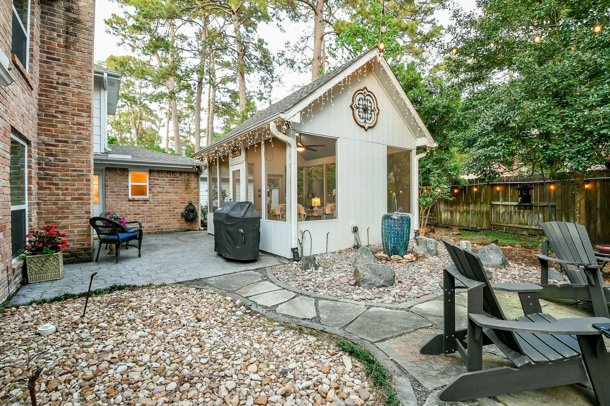 6607 Misty Springs Lane Spring, TX 77379 - Photo 27 of 31 Experience relaxation with the soothing flow of the elegant blue water fountain.