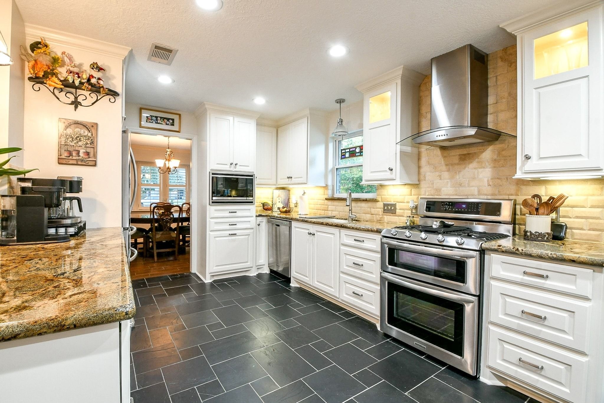 6607 Misty Springs Lane Spring, TX 77379 - Photo 6 of 31 This spacious kitchen features modern upgrades and ample room for movement, perfect for culinary enthusiasts.