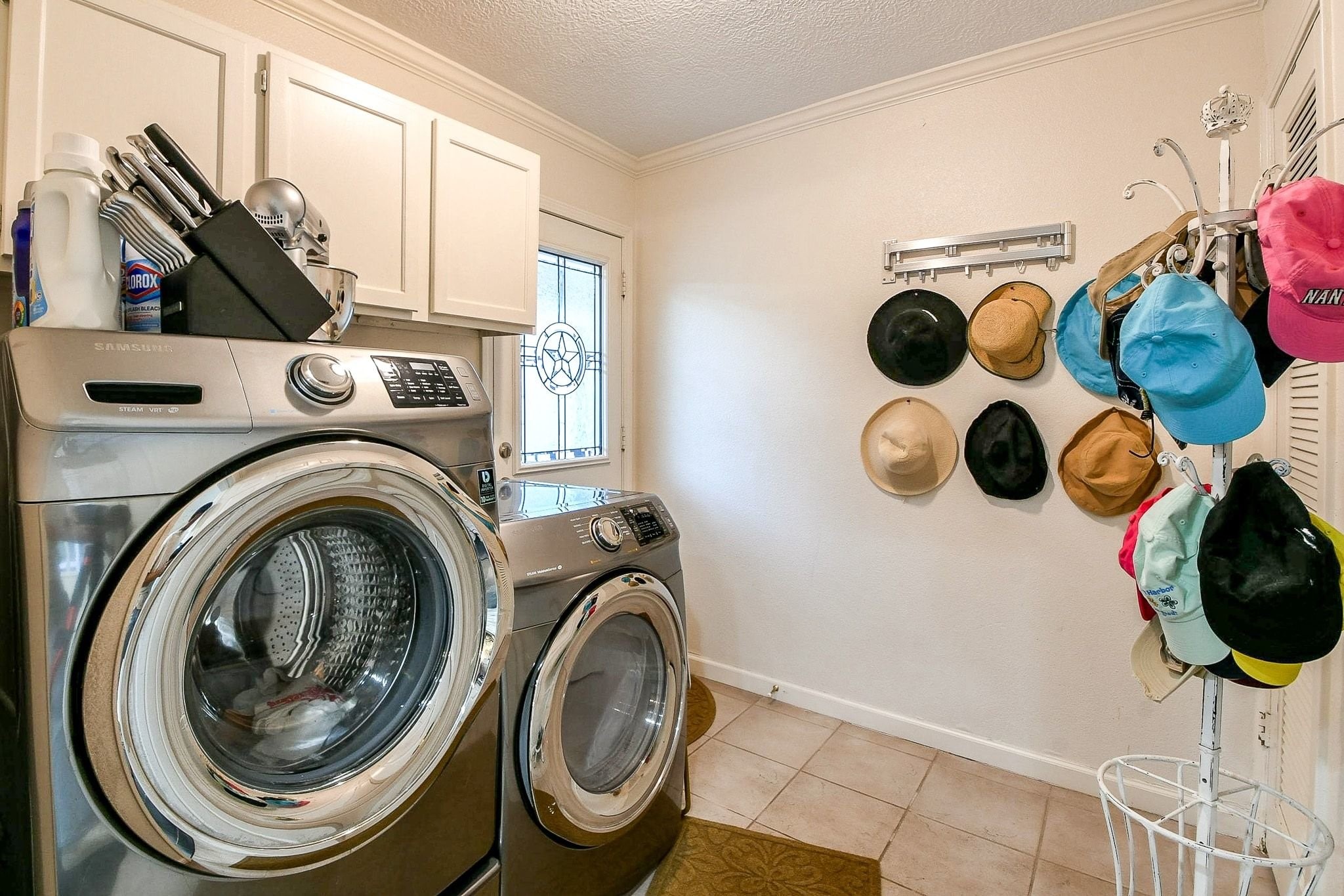 6607 Misty Springs Lane Spring, TX 77379 - Photo 9 of 31 The conveniently placed laundry room features a back door leading directly to the charming She Shed.