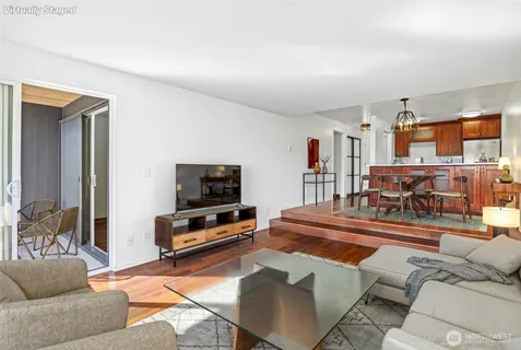 a view of a dining room with furniture window and wooden floor