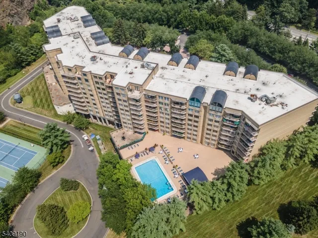 an aerial view of a multi story parking building