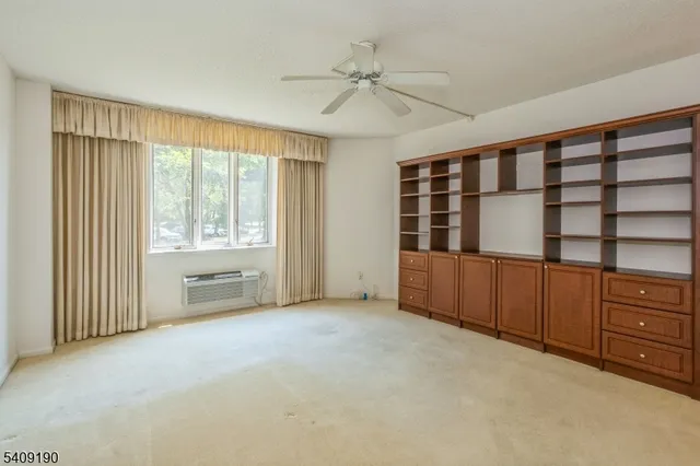 a view of walk in closet with clothes